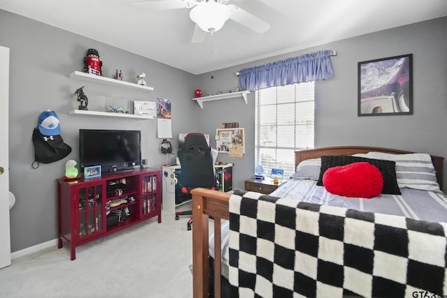 bedroom with carpet flooring, a ceiling fan, and baseboards