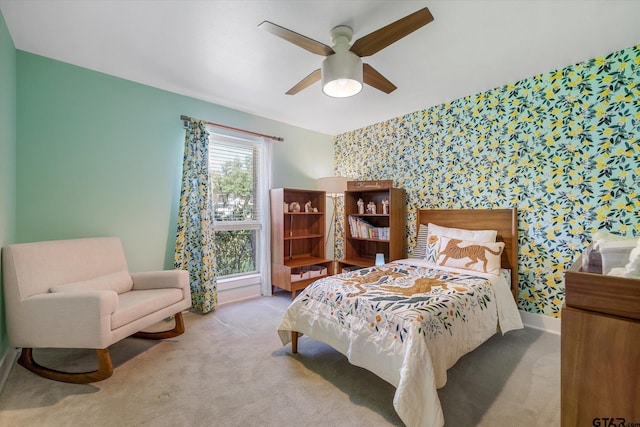 bedroom featuring ceiling fan and light colored carpet