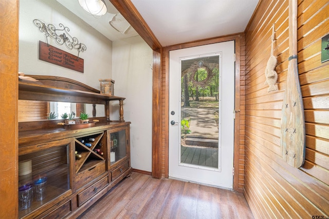 203 King Laurence Ct, Scroggins, TX 75480 - bar with wood finished floors, wood walls, and plenty of natural light