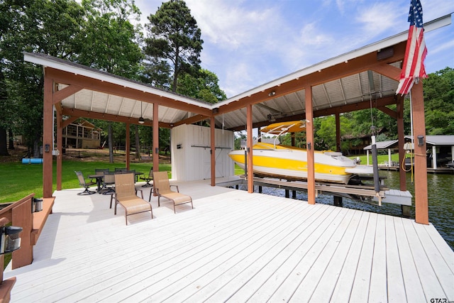 203 King Laurence Ct, Scroggins, TX 75480 - dock area with boat lift, a lawn, and a water view