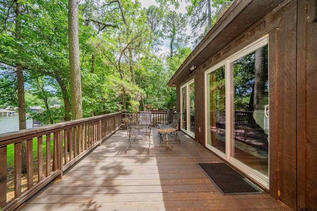 203 King Laurence Ct, Scroggins, TX 75480 - wooden terrace with view of wooded area