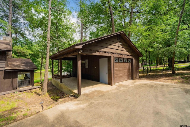 203 King Laurence Ct, Scroggins, TX 75480 - garage featuring a garage and driveway