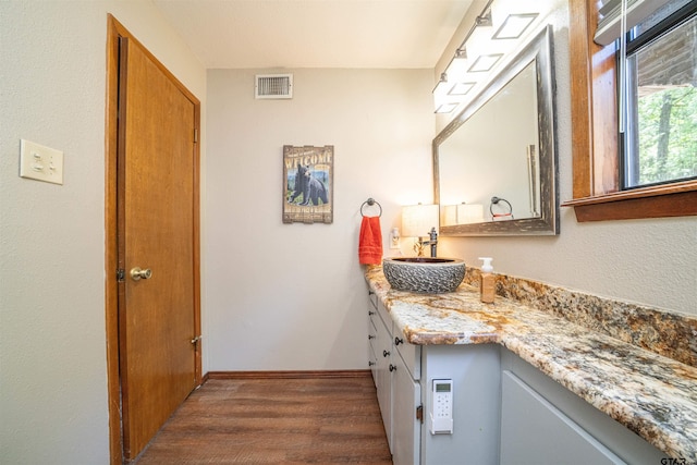 203 King Laurence Ct, Scroggins, TX 75480 - bathroom with wood finished floors, vanity, and baseboards