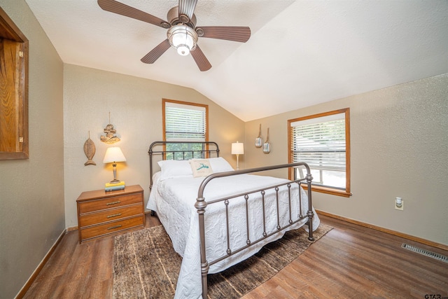 203 King Laurence Ct, Scroggins, TX 75480 - bedroom featuring wood finished floors, lofted ceiling, baseboards, a ceiling fan, and a textured wall