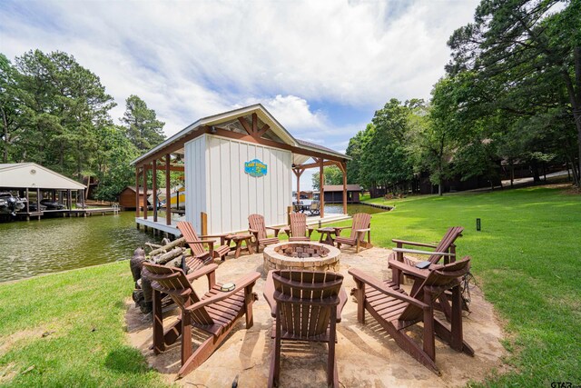 203 King Laurence Ct, Scroggins, TX 75480 - view of patio featuring a fire pit and a water view