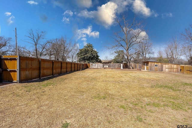 view of yard with a fenced backyard