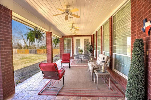 view of patio / terrace featuring a ceiling fan and fence