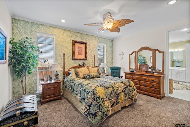 bedroom featuring connected bathroom, multiple windows, carpet, and crown molding