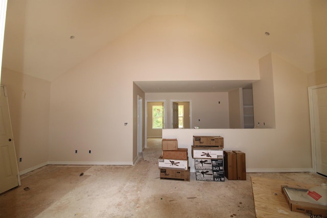 16966 Deer Run Rd, Flint, TX 75762 - unfurnished living room with high vaulted ceiling and baseboards