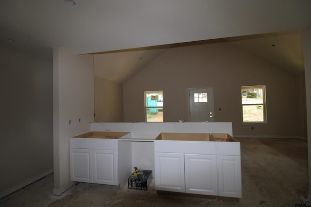 16966 Deer Run Rd, Flint, TX 75762 - kitchen featuring white cabinetry and lofted ceiling