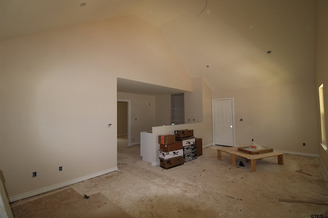 16966 Deer Run Rd, Flint, TX 75762 - unfurnished living room with high vaulted ceiling and baseboards