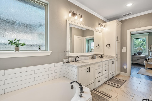 2921 Guinn Farms Rd, Tyler, TX 75707 - ensuite bathroom with double vanity, a bath, crown molding, baseboards, and marble look tiles