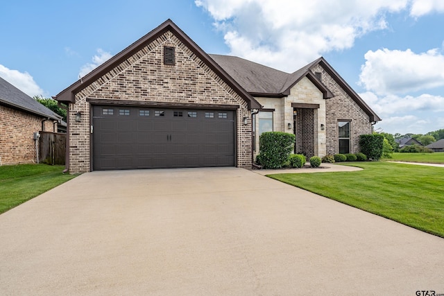 2921 Guinn Farms Rd, Tyler, TX 75707 - french country inspired facade with concrete driveway, a garage, brick siding, and a front yard