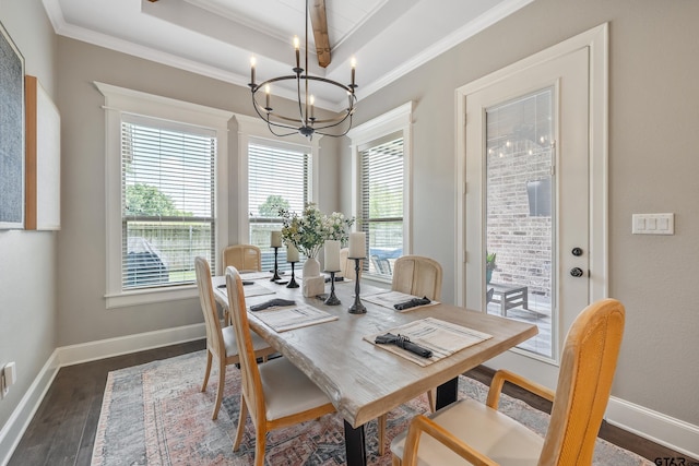 2921 Guinn Farms Rd, Tyler, TX 75707 - dining space with a chandelier, crown molding, dark wood-type flooring, a raised ceiling, and baseboards