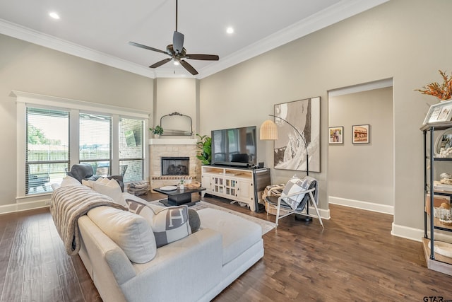 2921 Guinn Farms Rd, Tyler, TX 75707 - living area featuring baseboards, crown molding, dark wood finished floors, a fireplace with raised hearth, and a ceiling fan