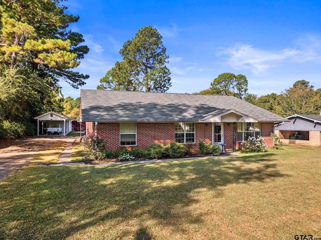 view of front of home with a front lawn and a carport