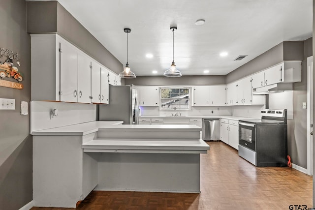 kitchen with kitchen peninsula, pendant lighting, appliances with stainless steel finishes, white cabinetry, and parquet flooring