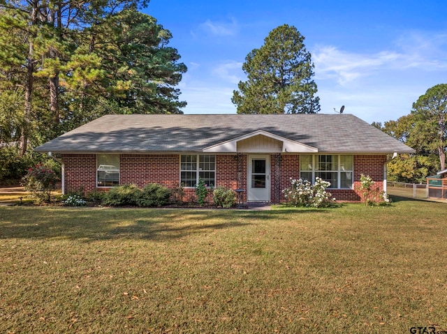 ranch-style home featuring a front yard