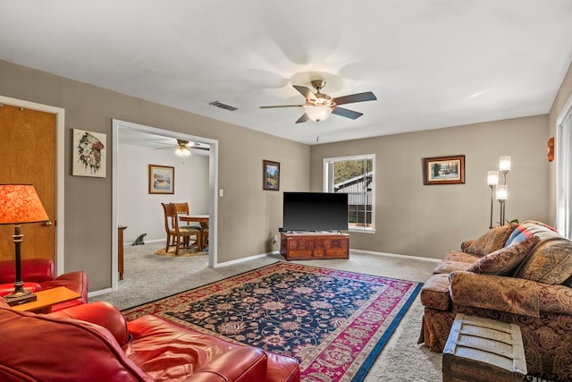 living room featuring ceiling fan and carpet flooring