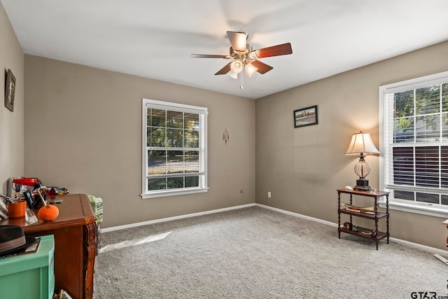 interior space with carpet flooring, ceiling fan, and plenty of natural light