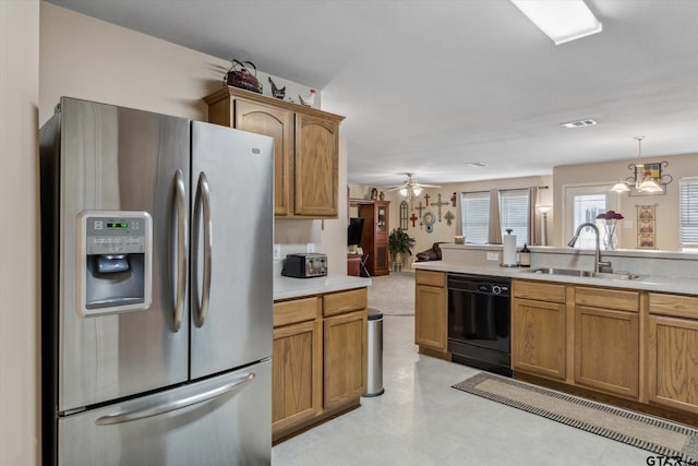 kitchen featuring ceiling fan, stainless steel refrigerator with ice dispenser, light countertops, a sink, and dishwasher