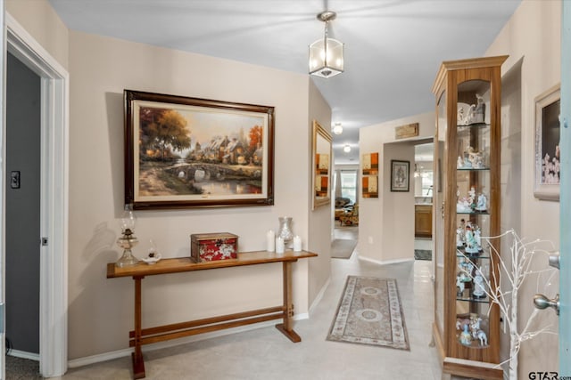 hallway featuring baseboards