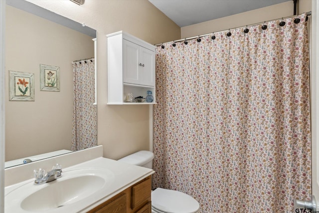 bathroom with toilet and vanity