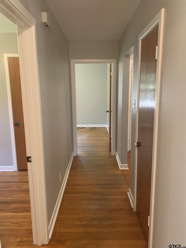 2326 Pleasant Dr, Tyler, TX 75701 - hallway with wood finished floors and baseboards