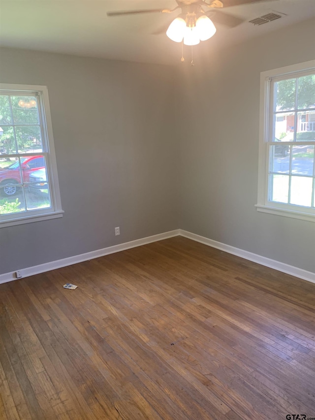 2326 Pleasant Dr, Tyler, TX 75701 - spare room featuring a ceiling fan and dark wood-style floors