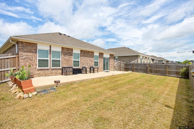 901 Martin St, Chandler, TX 75758 - back of property featuring a patio, brick siding, and a fenced backyard