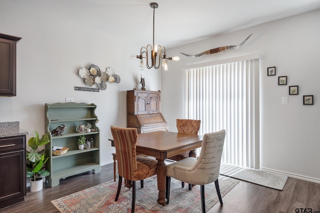 901 Martin St, Chandler, TX 75758 - dining space featuring healthy amount of natural light, a chandelier, and dark wood finished floors