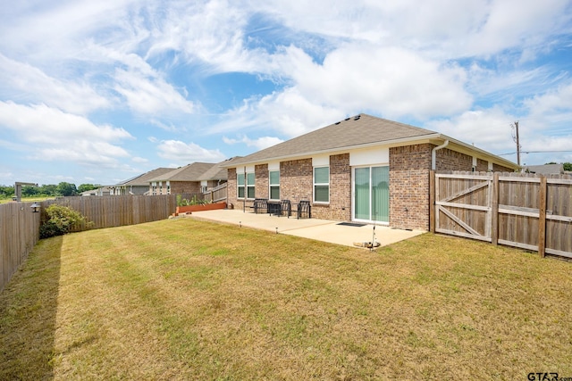 901 Martin St, Chandler, TX 75758 - back of house with a patio area, a fenced backyard, brick siding, and roof with shingles