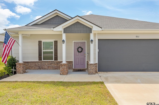 901 Martin St, Chandler, TX 75758 - craftsman-style house featuring brick siding, driveway, a garage, roof with shingles, and a front yard