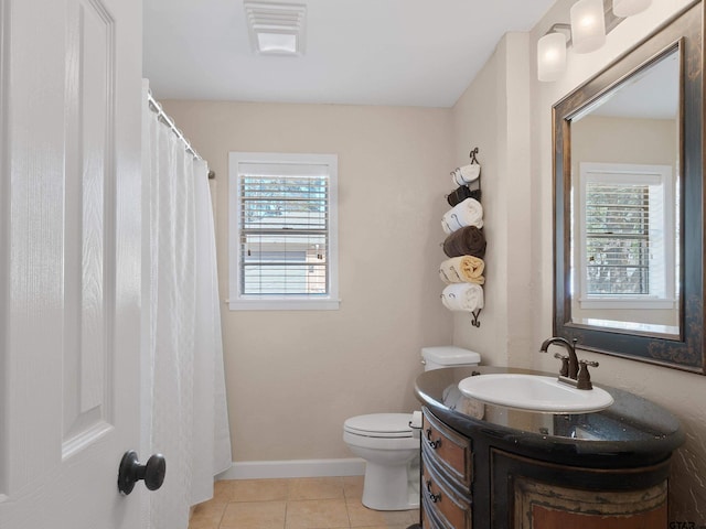 bathroom with vanity, tile patterned floors, and toilet