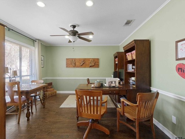 dining room featuring crown molding, ceiling fan, and dark hardwood / wood-style floors