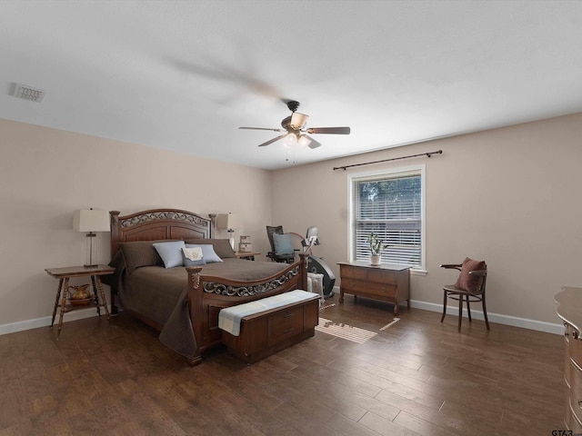 bedroom with dark wood-type flooring and ceiling fan