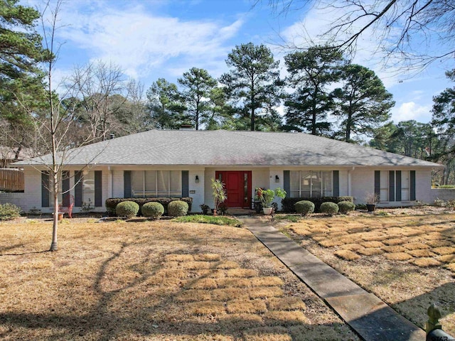 ranch-style home with a front yard