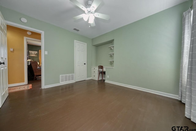 unfurnished bedroom with baseboards, visible vents, and wood finished floors