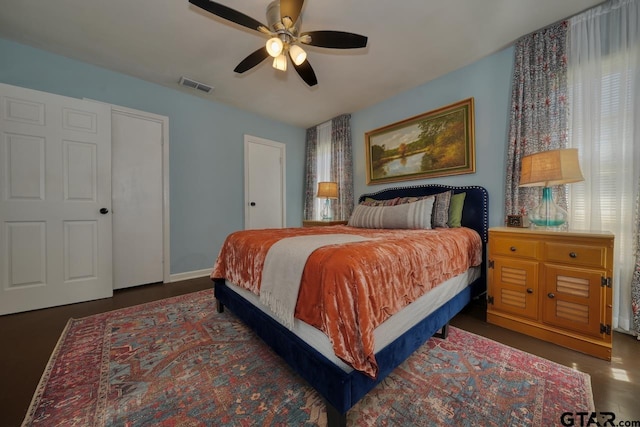 bedroom featuring visible vents, ceiling fan, and baseboards