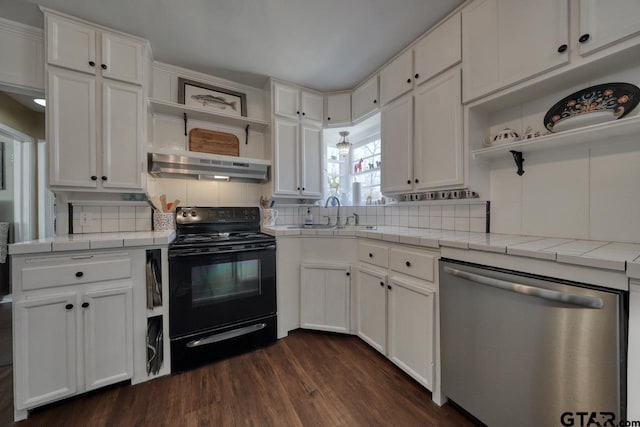 kitchen with under cabinet range hood, black electric range, stainless steel dishwasher, tile counters, and open shelves