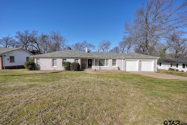 ranch-style home featuring concrete driveway, a front lawn, a chimney, and an attached garage