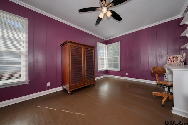 interior space with ceiling fan, crown molding, baseboards, and wood finished floors