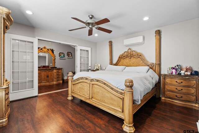 bedroom featuring french doors, dark hardwood / wood-style floors, a wall unit AC, and ceiling fan