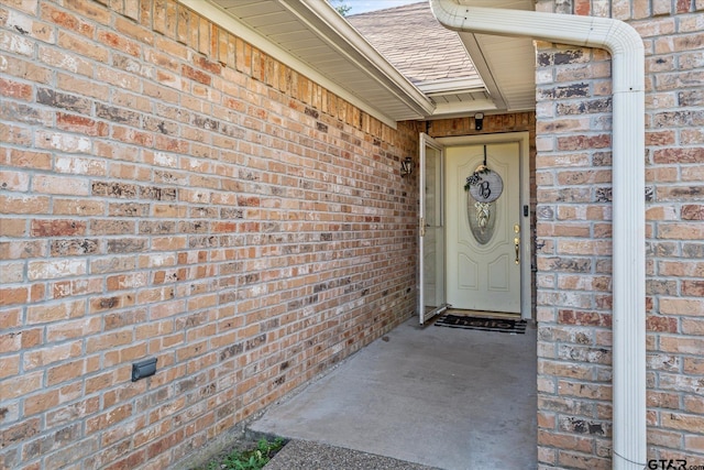 119 Vz County Road 4833, Chandler, TX 75758 - doorway to property featuring brick siding and roof with shingles