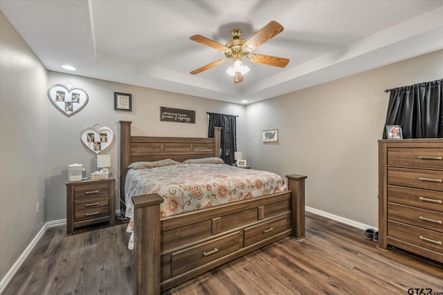 119 Vz County Road 4833, Chandler, TX 75758 - bedroom with a tray ceiling, baseboards, dark wood-type flooring, and a textured ceiling