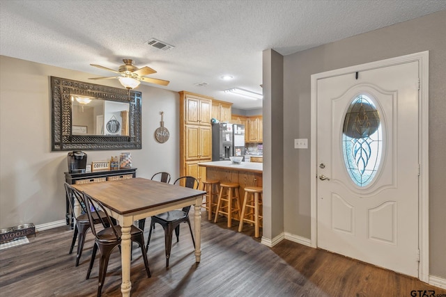 119 Vz County Road 4833, Chandler, TX 75758 - dining space featuring dark wood-style floors, baseboards, ceiling fan, and visible vents