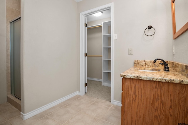 160 Lookout Point Dr, Grapeland, TX 75844 - full bathroom featuring a shower stall, tile patterned flooring, baseboards, and vanity