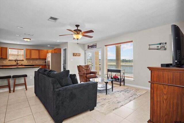 160 Lookout Point Dr, Grapeland, TX 75844 - living room with french doors, visible vents, ceiling fan, and light tile patterned floors