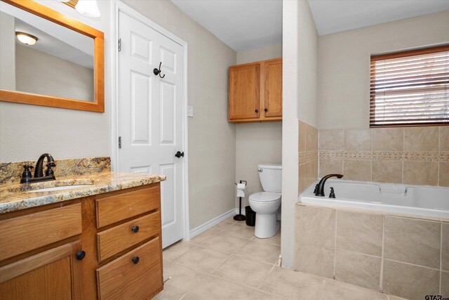 160 Lookout Point Dr, Grapeland, TX 75844 - full bath featuring toilet, vanity, baseboards, a bath, and tile patterned floors