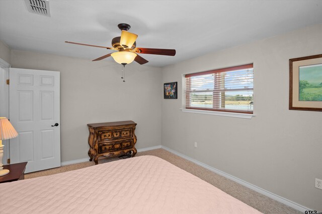 160 Lookout Point Dr, Grapeland, TX 75844 - bedroom featuring baseboards, visible vents, a ceiling fan, and light colored carpet